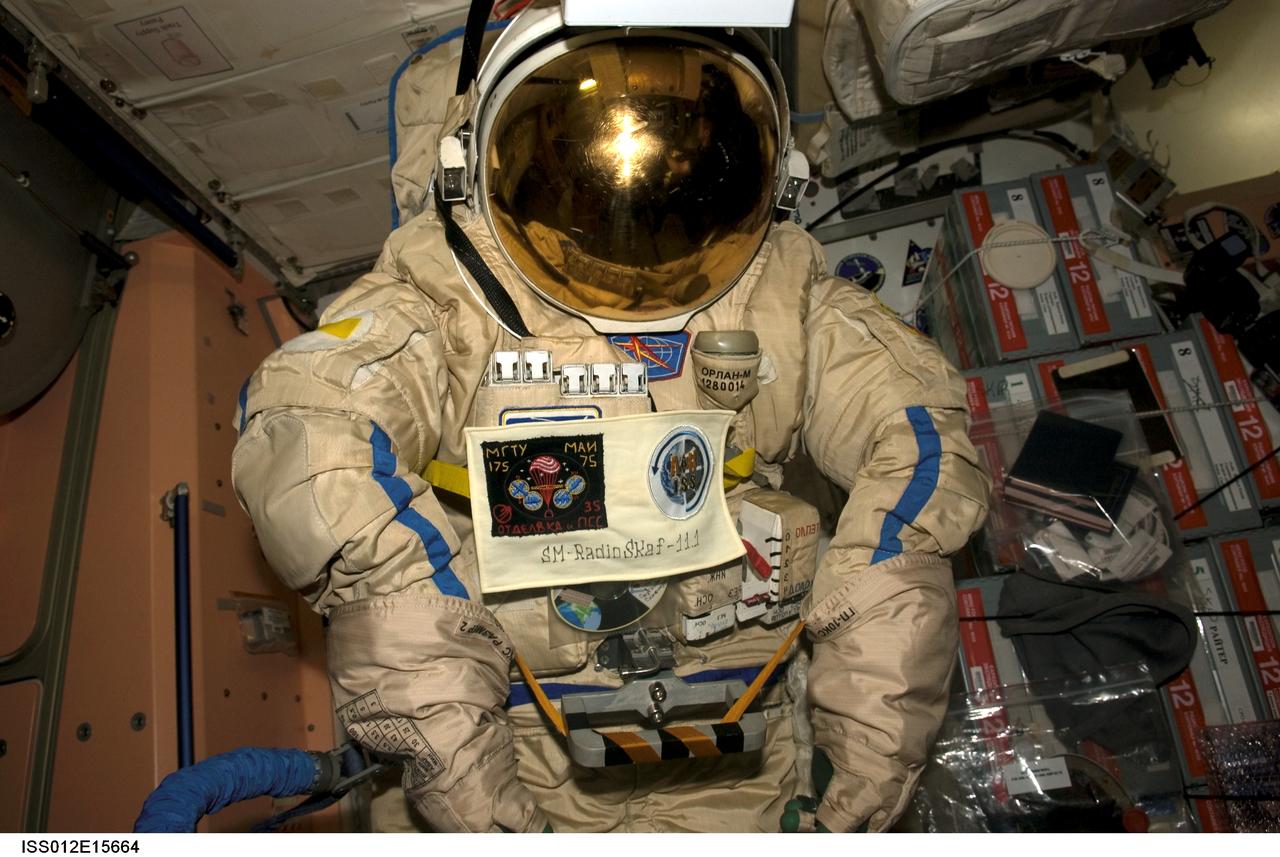 ISS012-E-15664 (24 Jan. 2006) --- An old Russian Orlan spacesuit is photographed in the Unity node of the International Space Station, which will be released by hand from the space station during a spacewalk Feb. 3, 2006. Outfitted with a special radio transmitter and other gear, the spacesuit comprises a Russian experiment called SuitSat. It will fly free from the station as a satellite in orbit for several weeks of scientific research and radio tracking, including communications by amateur radio operators. Eventually, it will enter the atmosphere and be destroyed.