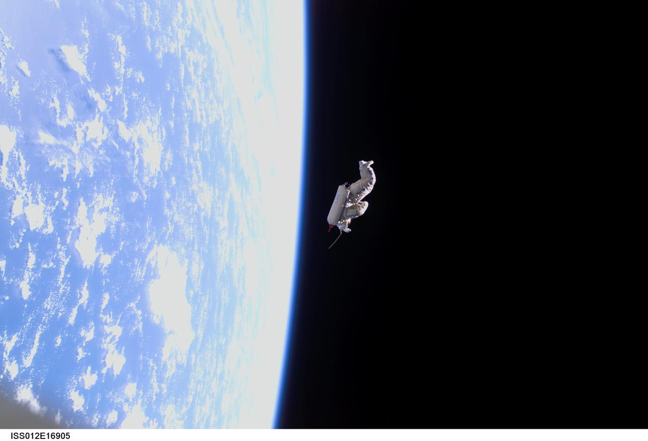 ISS012-E-16905 (3 Feb. 2006) --- Backdropped by the blackness of space and Earth&#0146;s horizon, a spacesuit-turned-satellite called SuitSat began its orbit around the Earth after it was released by the Expedition 12 crewmembers during a session of extravehicular activity (EVA) on Feb. 3, 2006. SuitSat, an unneeded Russian Orlan spacesuit, was outfitted by the crew with three batteries, internal sensors and a radio transmitter, which faintly transmitted recorded voices of school children to amateur radio operators worldwide. The suit will enter the atmosphere and burn up in a few weeks.