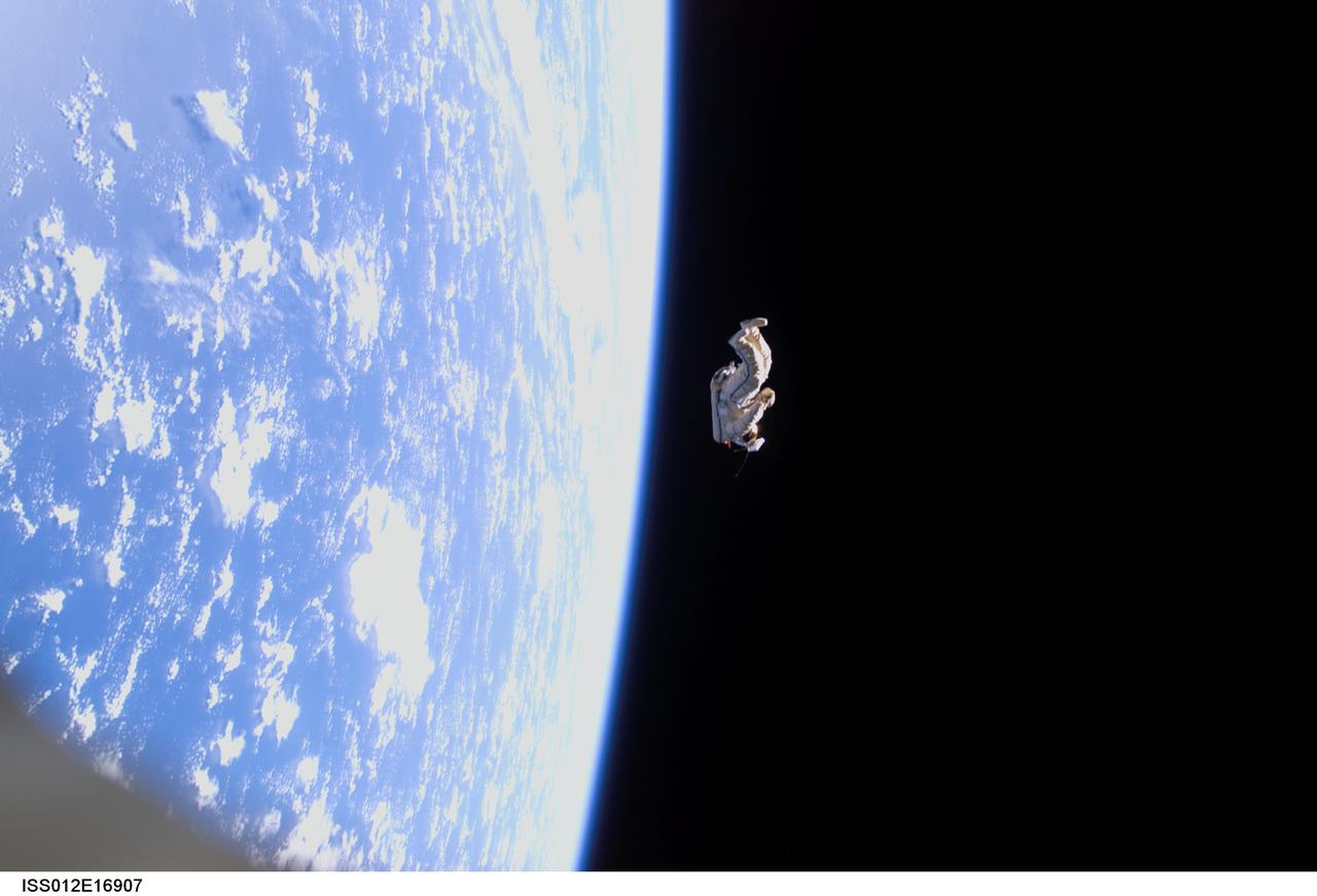 ISS012-E-16907 (3 Feb. 2006) --- Backdropped by the blackness of space and Earth&#0146;s horizon, a spacesuit-turned-satellite called SuitSat began its orbit around the Earth after it was released by the Expedition 12 crewmembers during a session of extravehicular activity (EVA) on Feb. 3, 2006. SuitSat, an unneeded Russian Orlan spacesuit, was outfitted by the crew with three batteries, internal sensors and a radio transmitter, which faintly transmitted recorded voices of school children to amateur radio operators worldwide. The suit will enter the atmosphere and burn up in a few weeks.
