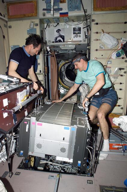 NASA image: McArthur and Tokarev lift TVIS from the SM pit during TVIS inspection on Expedition 12