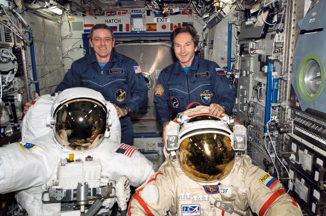 NASA image: McArthur and Tokarev pose with EMUs during Expedition 12