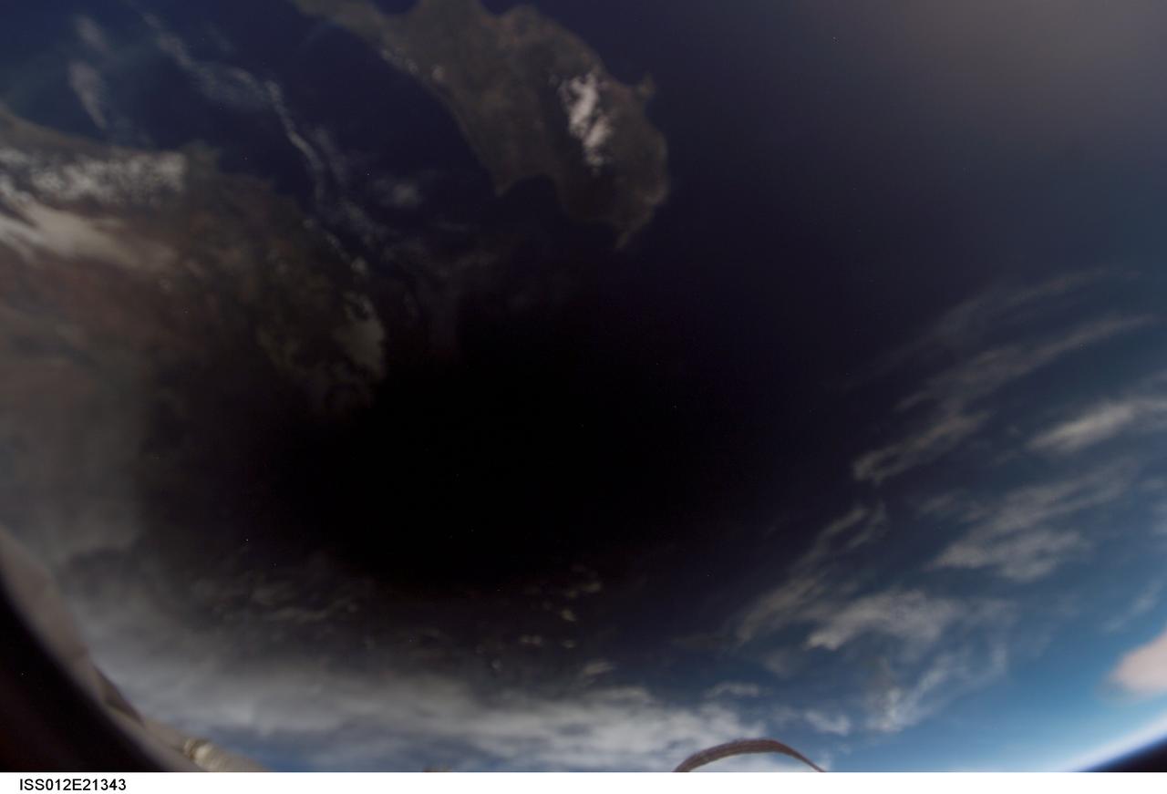 ISS012-E-21343 (29 Mar. 2006) --- The shadow of the moon falls on Earth as seen from the International Space Station, 230 miles above the planet, during a total solar eclipse at about 4:50 a.m. CST Wednesday, March 29. This digital photo was taken by the Expedition 12 crew, Commander William McArthur and Flight Engineer Valery Tokarev, who are wrapping up a six-month mission on the complex. Visible near the shadow are portions of Cyprus in the Mediterranean Sea and the coast of Turkey.