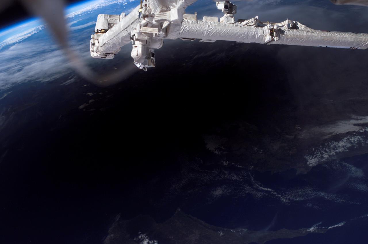 ISS012-E-21351 (29 Mar. 2006) --- The shadow of the moon falls on Earth as seen from the International Space Station, 230 miles above the planet, during a total solar eclipse at about 4:50 a.m. CST, Wednesday, March 29. This digital photo was taken by the Expedition 12 crew, Commander Bill McArthur and Flight Engineer Valery Tokarev, who are wrapping up a six-month mission on the complex.  Part of the Mediterranean Sea can be seen outside the shadow.