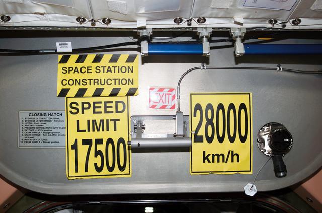 NASA image: View of Speed Limit signs on the PMA 1 hatch during Expedition 12