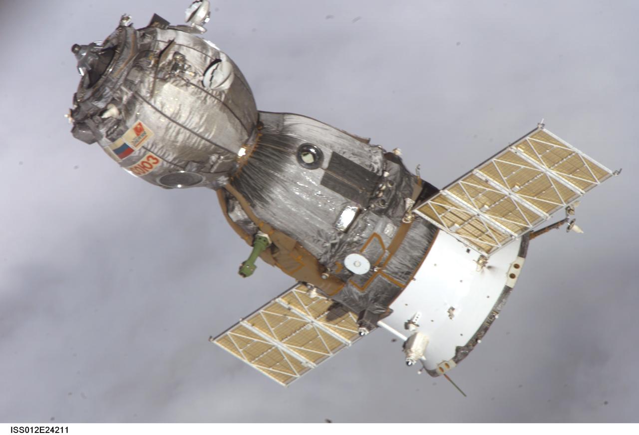 ISS012-E-24211 (8 April 2006) --- Backdropped by a blanket of clouds, the Soyuz TMA-7 spacecraft departs from the International Space Station carrying astronaut William S. (Bill) McArthur Jr., Expedition 12 commander and NASA space station science officer; Russian Federal Space Agency cosmonaut Valery I. Tokarev, flight engineer; and Brazilian Space Agency astronaut Marcos C. Pontes. Undocking occurred at 2:48 p.m. (CDT) on April 8.