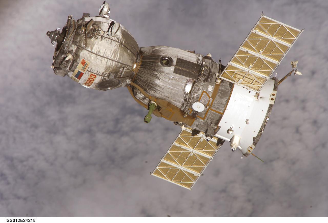 ISS012-E-24218 (8 April 2006) --- Backdropped by a blanket of clouds, the Soyuz TMA-7 spacecraft departs from the International Space Station carrying astronaut William S. (Bill) McArthur Jr., Expedition 12 commander and NASA space station science officer; Russian Federal Space Agency cosmonaut Valery I. Tokarev, flight engineer; and Brazilian Space Agency astronaut Marcos C. Pontes. Undocking occurred at 2:48 p.m. (CDT) on April 8.