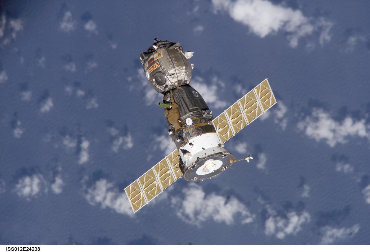 ISS012-E-24238 (8 April 2006) --- Backdropped by a blue and white Earth, the Soyuz TMA-7 spacecraft departs from the International Space Station carrying astronaut William S. (Bill) McArthur Jr., Expedition 12 commander and NASA space station science officer; Russian Federal Space Agency cosmonaut Valery I. Tokarev, flight engineer; and Brazilian Space Agency astronaut Marcos C. Pontes. Undocking occurred at 2:48 p.m. (CDT) on April 8.