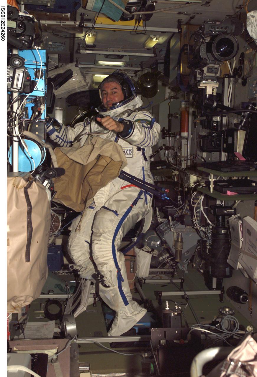 ISS012-E-24260 (8 April 2006) --- Brazilian Space Agency astronaut Marcos C. Pontes, attired in a Russian Sokol spacesuit, works in the Destiny laboratory of the International Space Station prior to his departure in a Soyuz TMA-7 spacecraft.