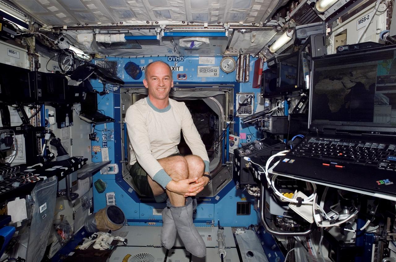 ISS013-E-05638 (9 April 2006) --- Astronaut Jeffrey N. Williams, Expedition 13 NASA space station science officer and flight engineer, floats in the Destiny laboratory of the International Space Station.