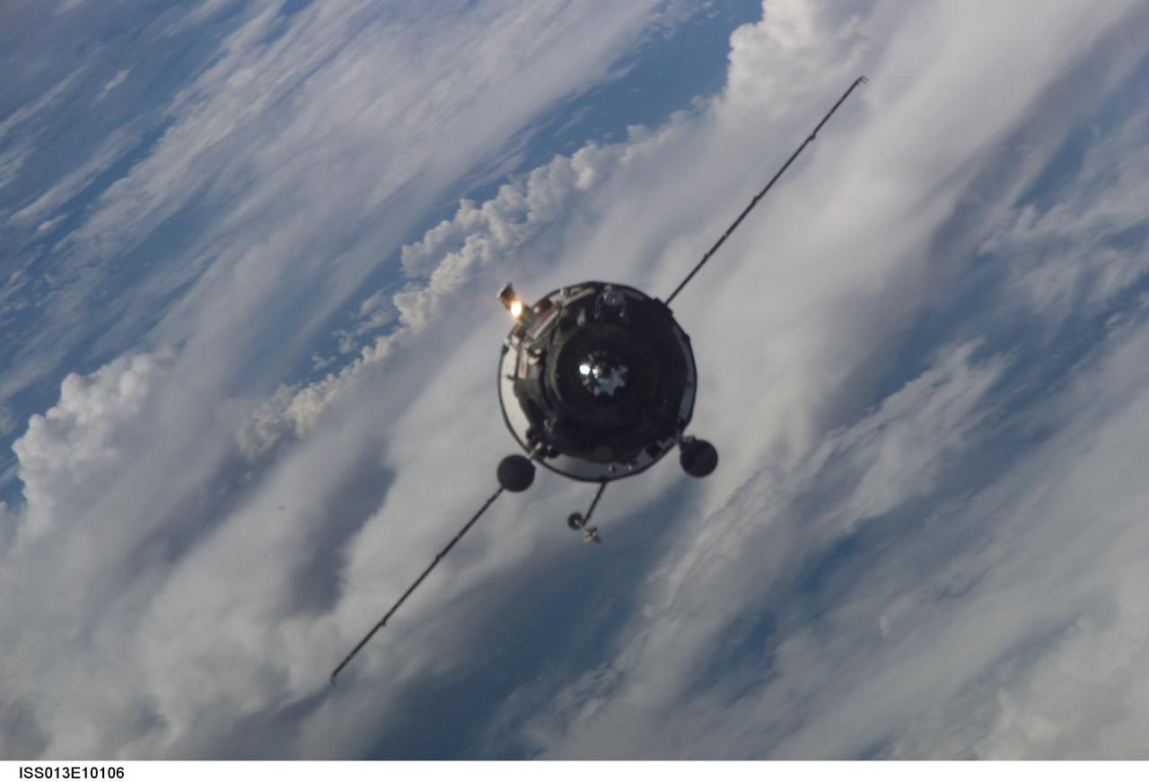 ISS013-E-10106 (26 April 2006) --- Backdropped by a blue and white Earth, an unpiloted Progress supply vehicle approaches the International Space Station. The Progress 21 resupply craft launched at 11:03 a.m. (CDT) on April 24, 2006 from the Baikonur Cosmodrome in Kazakhstan to deliver 2.5 tons of food, water, fuel, oxygen, spare parts and other supplies to the Expedition 13 crewmembers onboard the station. Progress docked to the aft port of the Zvezda Service Module at 12:41 p.m. (CDT) on April 26 as the spacecraft and the station flew approximately 219 miles above a point near Greece.