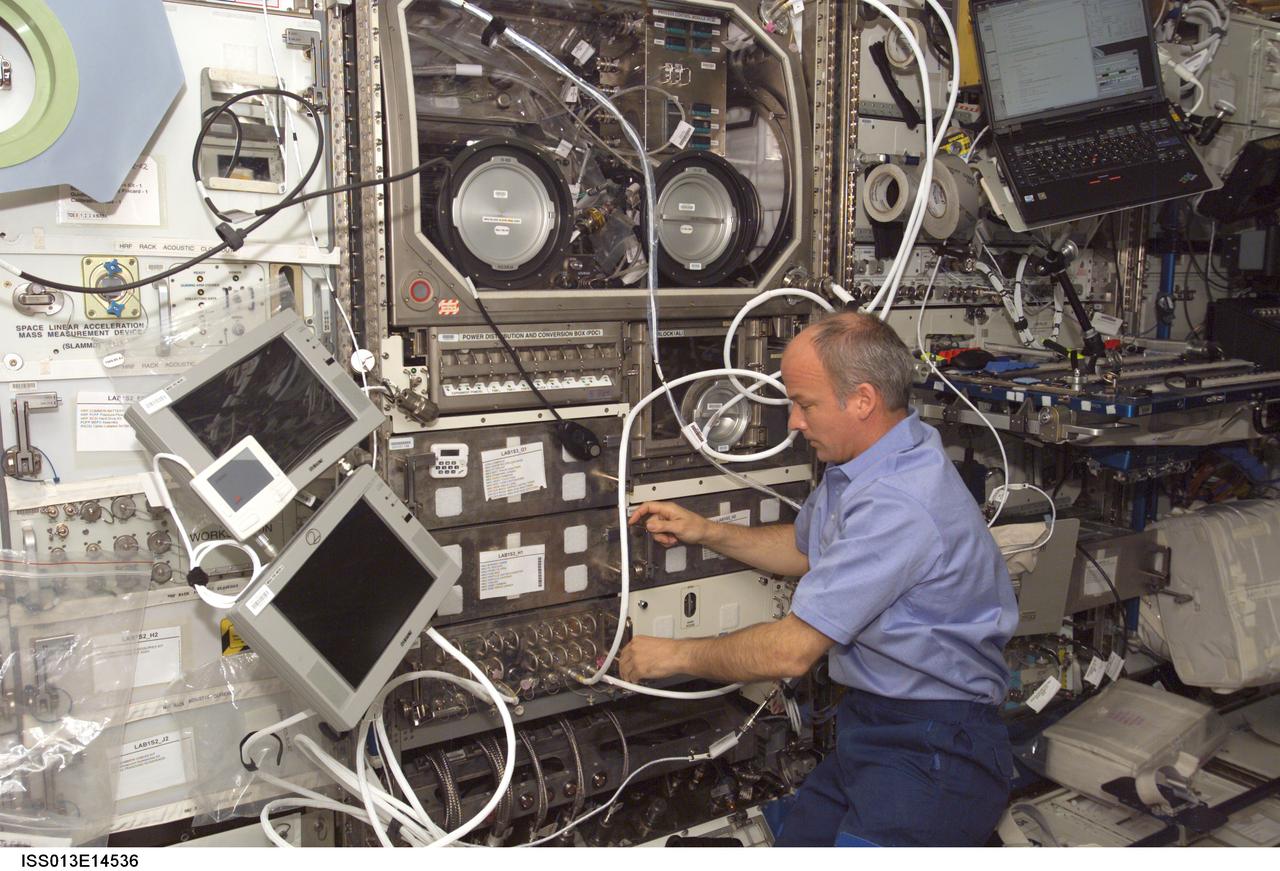 ISS013-E-14536 (4 May 2006) --- Astronaut Jeffrey N. Williams, Expedition 13 NASA space station science officer and flight engineer, conducts the first run of the Pore Formation and Mobility Investigation (PFMI) in the Microgravity Science Glovebox (MSG) in the Destiny laboratory of the International Space Station.