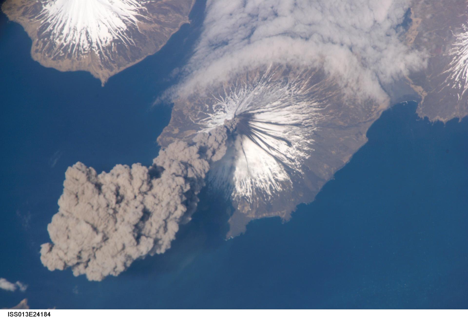 Eruption of Cleveland Volcano, Aleutian Islands, Alaska is featured in this image photographed by an Expedition 13 crewmember on the International Space Station. A cloud of grey smoke and ash is seen coming out of the volcano.
