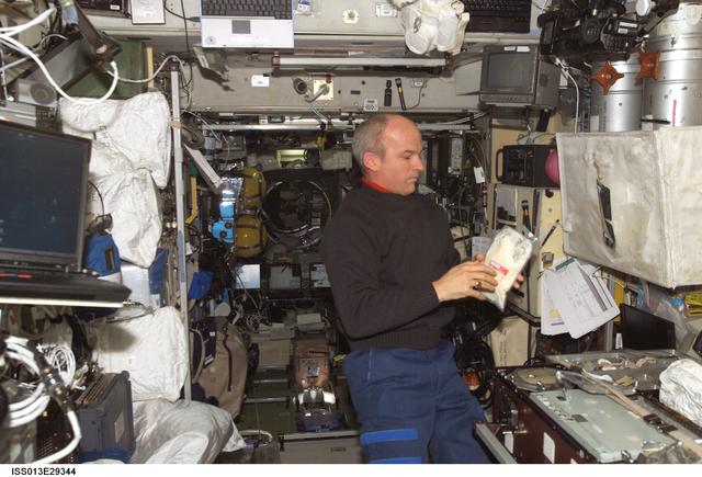 NASA image: Williams holds package of food in the SM during Expedition 13