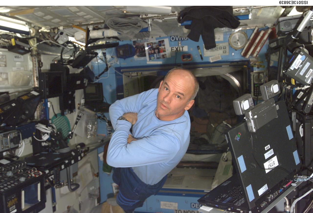 ISS013-E-36839 (12 June 2006) --- Astronaut Jeffrey N. Williams, Expedition 13 NASA space station science officer and flight engineer, floats in the Destiny laboratory of the International Space Station.