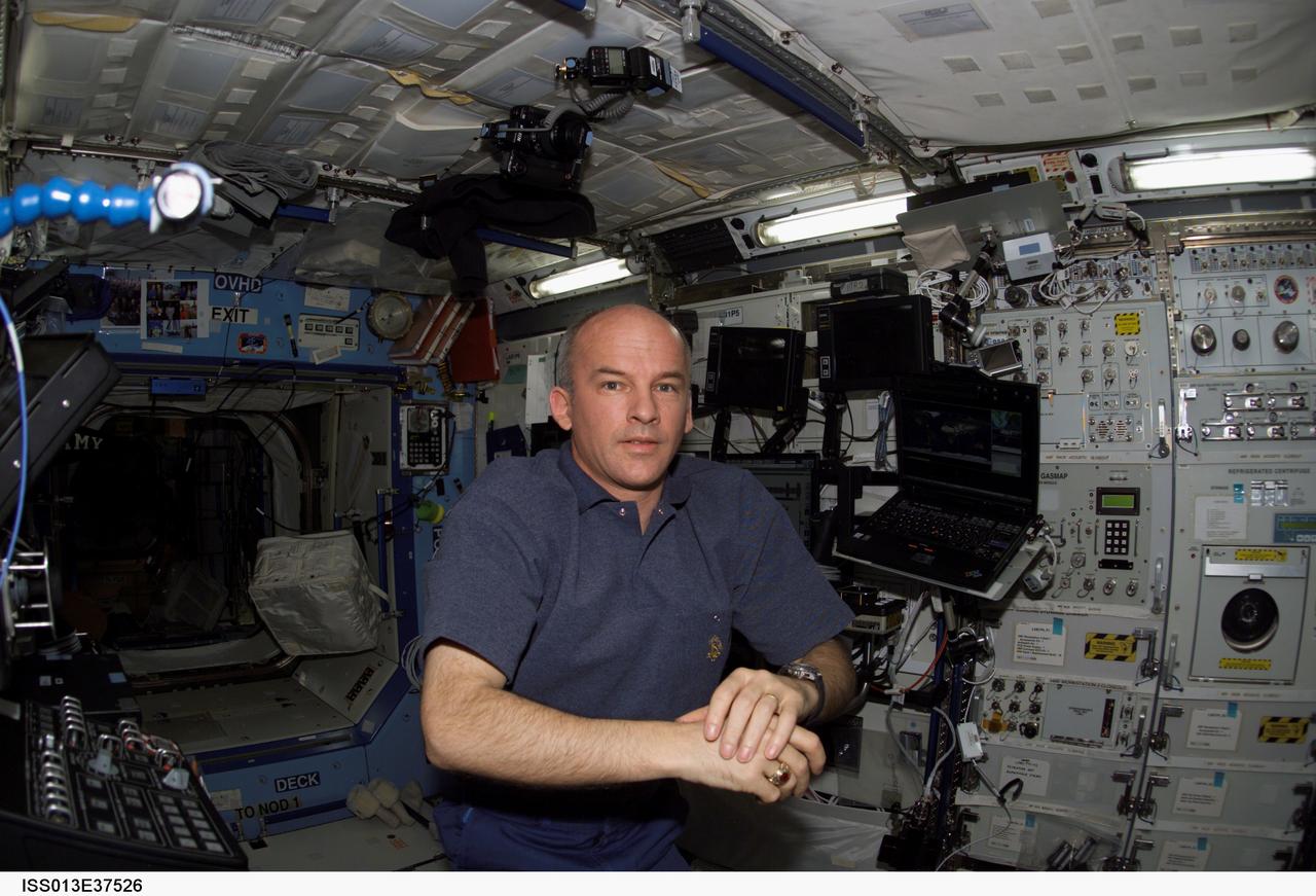 ISS013-E-37526 (14 June 2006) --- Astronaut Jeffrey N. Williams, Expedition 13 NASA space station science officer and flight engineer, ponders his next task in the Destiny laboratory of the International Space Station.