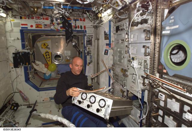 NASA image: Williams works with the GASMAP section of the HRF rack in the U.S. Laboratory during Expedition 13