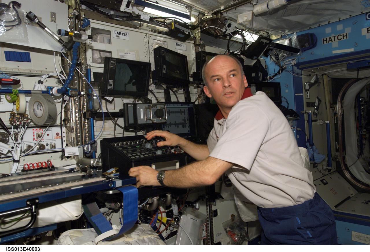 Williams operates the SSRMS in the U.S. Laboratory taken during Expedition 13