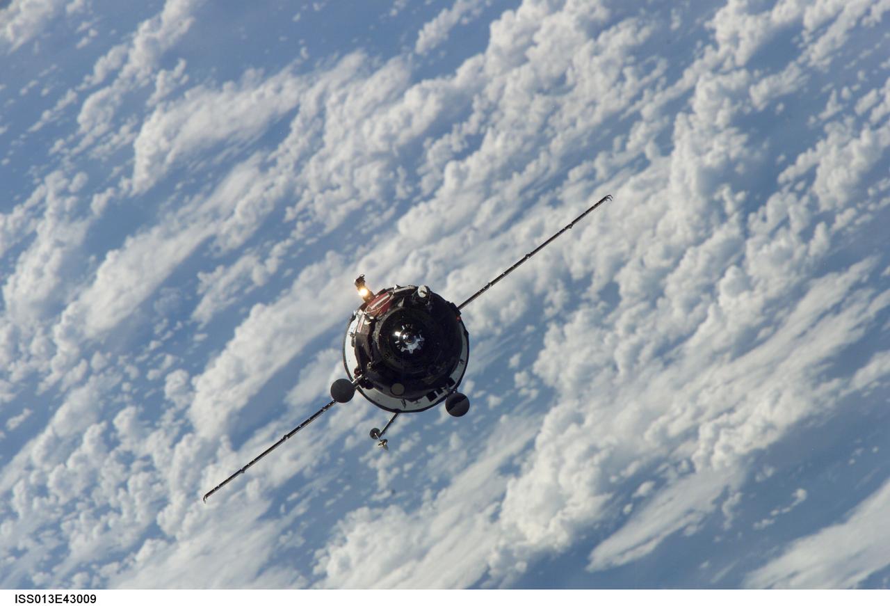 ISS013-E-43009 (26 June 2006) --- Backdropped by a blue and white Earth, an unpiloted Progress supply vehicle approaches the International Space Station. The Progress 22 resupply craft launched at 10:08 a.m. (CDT) on June 24, 2006 from the Baikonur Cosmodrome in Kazakhstan to deliver 2.5 tons of food, water, fuel, oxygen and other supplies to the Expedition 13 crewmembers onboard the station. Progress automatically docked to the Pirs Docking Compartment at 11:25 a.m. (CDT) on June 26 as the spacecraft and the station flew approximately 220 miles above a point near northern Africa.