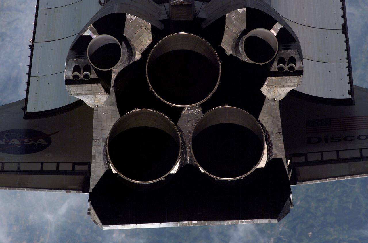 ISS013-E-47629 (6 July 2006) --- A close-up view of Space Shuttle Discovery's tail section is featured in this image photographed by an Expedition 13 crewmember on the International Space Station during STS-121 R-Pitch Maneuver survey on Flight Day 3. Visible are the shuttle's main engines, vertical stabilizer, orbital maneuvering system (OMS) pods, reaction control system (RCS) jets and a portion of payload bay door radiator and wings.