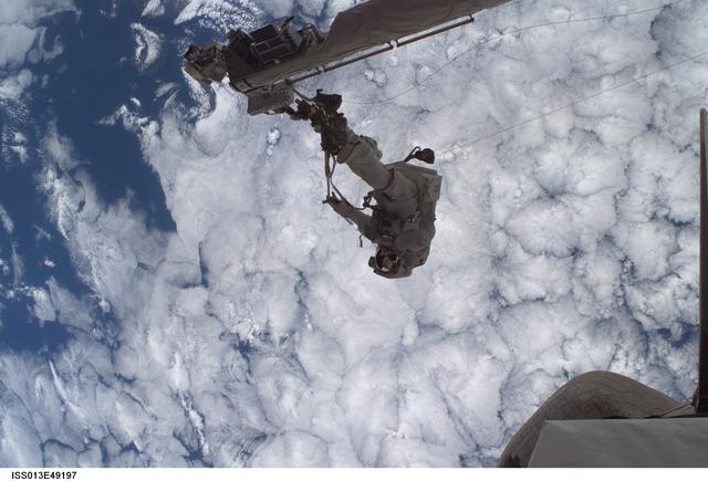 NASA image: Sellers anchored to the Space Shuttle Discoverys RMS OBSS foot restraint during STS-121 EVA