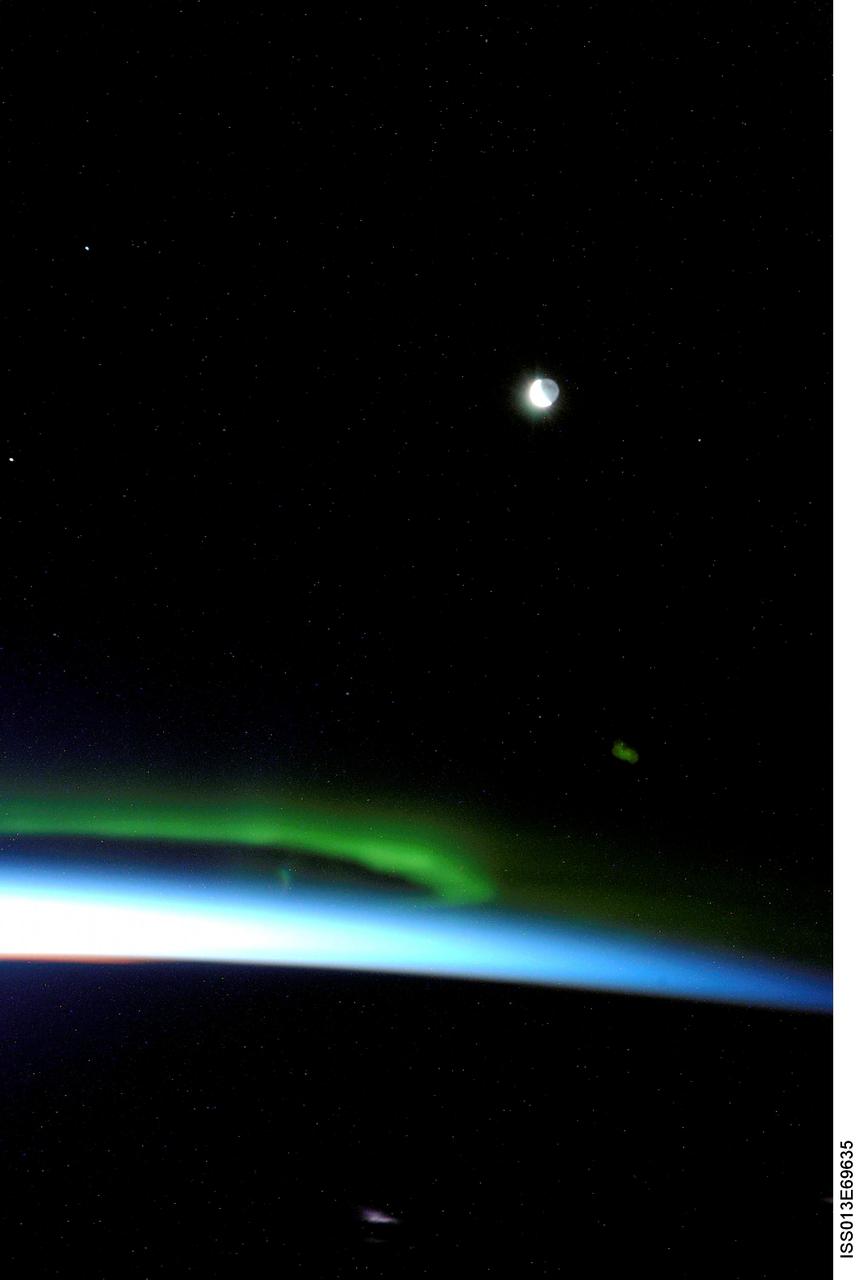 ISS013-E-69635 (19 Aug. 2006) --- The Aurora Borealis, also known as "northern lights", is featured in this photograph taken by an Expedition 13 crewmember on the International Space Station. The moon is visible at upper right.