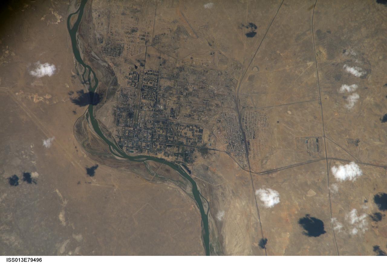 ISS013-E-79496 (9 Sept. 2006) --- This picture, photographed from the International Space Station by an Expedition 13 crewmember, includes the Baikonur launch complex and thus has special significance for the Expedition 13 crew and all crews who have launched aboard Soyuz craft to join the orbital outpost. Baikonur, formerly known as Leninsk, is a city within Kazakhstan, but it is rented and administered by Russia. It was constructed to service the Baikonur Cosmodrome and was officially renamed Baikonur by Boris Yeltsin on December 20, 1995. The name Baikonur is Kazakh for "wealthy brown," i.e. "fertile land with many herbs."