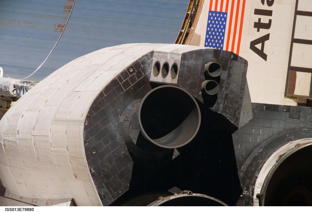 ISS013-E-79880 (11 Sept. 2006) --- This view of part of the  starboard wing and one of the Orbital Maneuvering System (OMS) pods of the Space Shuttle Atlantis was provided by an Expedition 13 crew member during a backflip maneuver performed by the approaching visitors to the International Space Station.