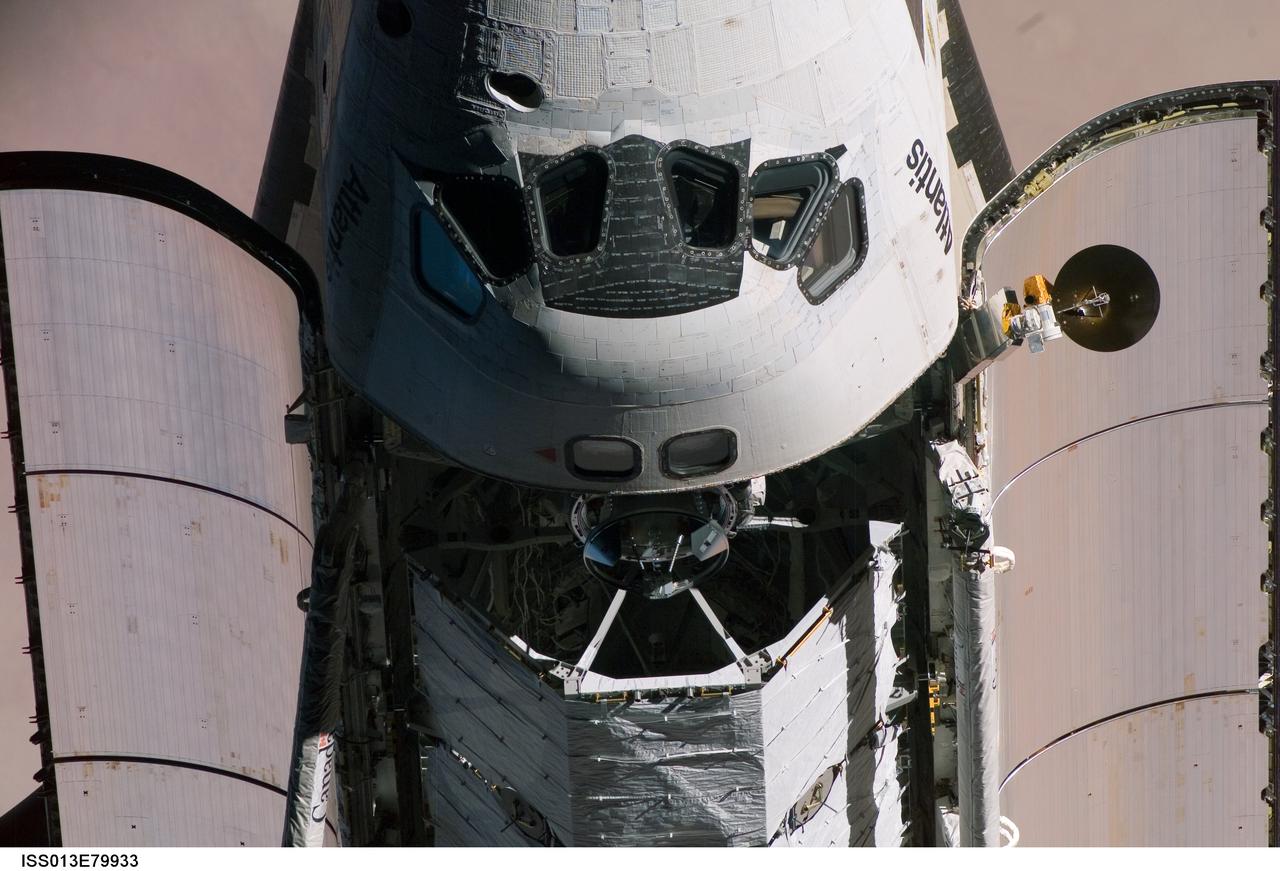 ISS013-E-79933 (11 Sept. 2006) --- This view of part of the crew cabin and the forward portion of the cargo bay of the Space Shuttle Atlantis was provided by an Expedition 13 crew member during a backflip maneuver performed by the approaching visitors to the International Space Station.  Part of the P3/P4 Integrated Truss Structure can be seen in the stowed position.