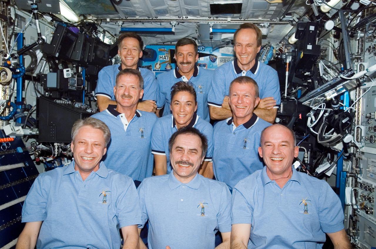 ISS013-E-81630 (16 Sept. 2006) --- The Expedition 13 and STS-115 crewmembers gather for a group portrait during a joint crew press conference in the Destiny laboratory of the International Space Station while Space Shuttle Atlantis was docked with the station. From the left (front row) are European Space Agency (ESA) astronaut Thomas Reiter, Expedition 13 flight engineer; cosmonaut Pavel V. Vinogradov, commander representing Russia's Federal Space Agency; and astronaut Jeffrey N. Williams, NASA space station science officer and flight engineer. From the left (second row) are astronauts Joseph R. Tanner, Heidemarie M. Stefanyshyn-Piper, both STS-115 mission specialists; and Brent W. Jett, Jr., STS-115 commander. From the left (top row) are astronauts Christopher J. Ferguson, pilot; Daniel C. Burbank and Canadian Space Agency astronaut Steven G. MacLean, both mission specialists.