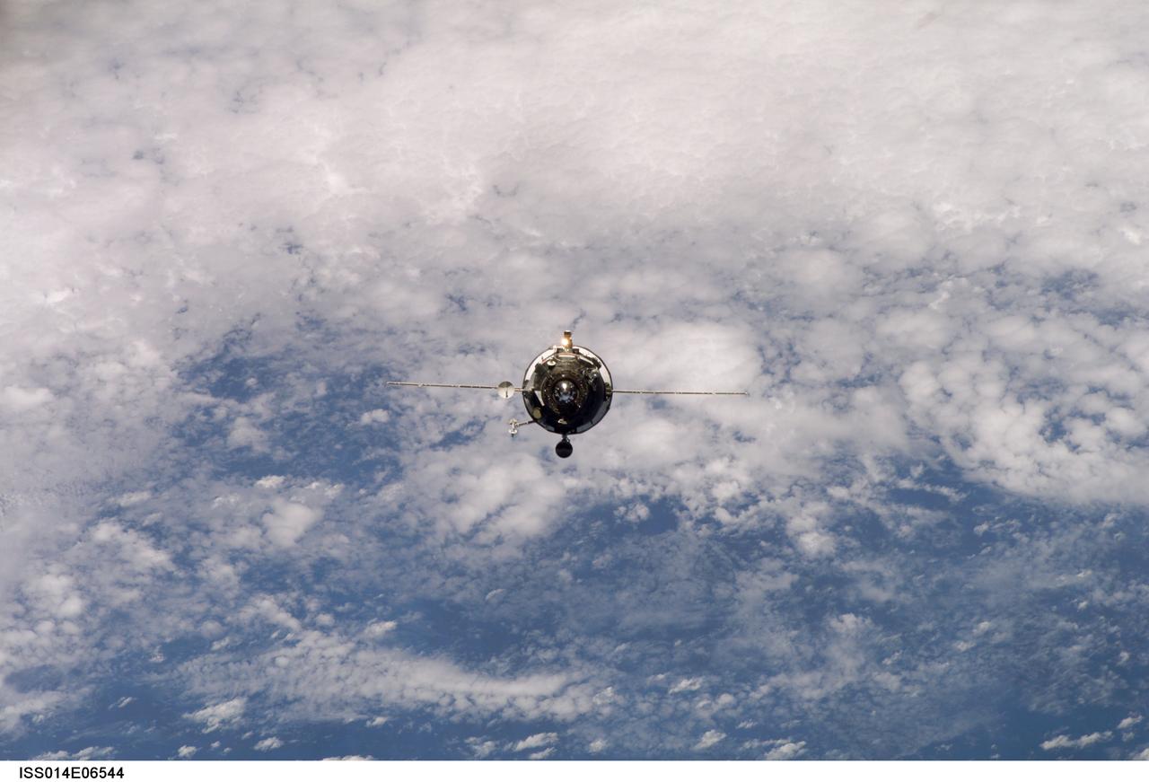 ISS014-E-06544 (26 Oct. 2006) --- Backdropped by a blue and white Earth, an unpiloted Progress supply vehicle approaches the International Space Station. Progress docked to the aft port of the Zvezda Service Module at 9:29 a.m. (CDT) on Oct. 26. The spacecraft used the automated Kurs system to dock at the aft port of the Zvezda service module. Expedition 14 flight engineer Mikhail Tyurin stood by at the manual Toru docking system controls, but the automated system functioned as designed and manual intervention was not needed.