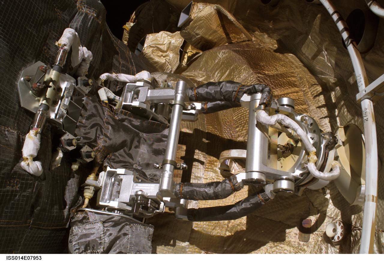 ISS014-E-07953 (22 Nov. 2006) ---This photo shows the position of the KURS antennae on 23 Progress as seen by spacewalkers Michael Lopez-Alegria and Mikhail Tyurin during Russian EVA 17 on Nov. 22.  During docking of the Progress to the International Space Station on Oct. 26, 2006, flight controllers were unable to confirm if the antenna had retracted as commanded. On the right-hand side of the photo, there is a visible clearance between the antennae's satellite dish and handrail 2745 on the ISS Service Module.