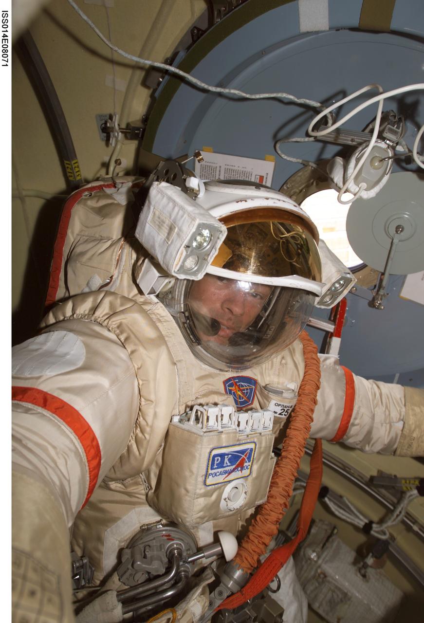 ISS014-E-08071 (17 Nov. 2006) --- Astronaut Michael E. Lopez-Alegria, Expedition 14 commander, participates in an Russian Orlan spacesuit translation exercise in the Pirs Docking Compartment of the International Space Station as the crewmembers prepare for their spacewalk scheduled for Nov. 22.