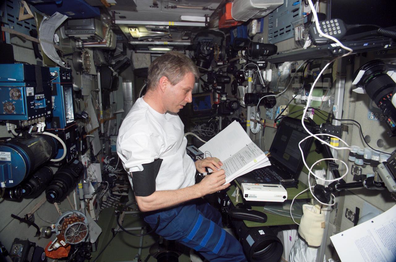 ISS014-E-08795 (29 Nov. 2006) --- European Space Agency (ESA) astronaut Thomas Reiter, Expedition 14 flight engineer, works with the Cognitive Cardiovascular (Cardiocog-2) experiment in the Zvezda Service Module of the International Space Station. Cardiocog-2 will determine the impact of weightlessness on the cardiovascular system and respiratory system and the cognitive reactions of crewmembers. The results of this study will be used to develop additional countermeasures that will continue to keep crewmembers healthy during long-duration space exploration.