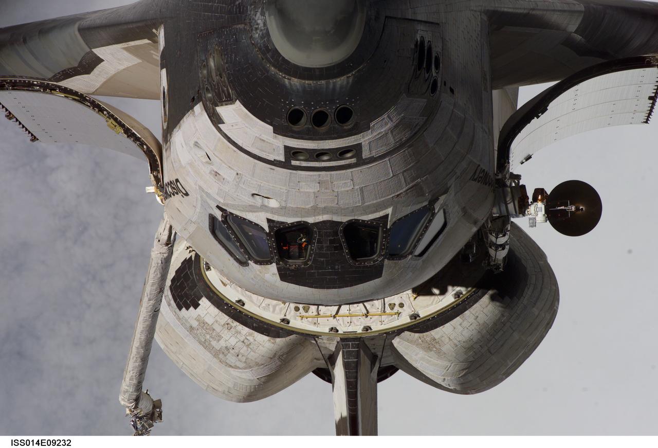 ISS014-E-09232 (11 Dec. 2006) --- This view of the nose and part of the crew cabin of Space Shuttle Discovery was provided by an Expedition 14 crewmember during a back-flip performed by the approaching STS-116 crew to the International Space Station. The Ku-band antenna, very instrumental in communications operations, is visible on the port side of the orbiter.