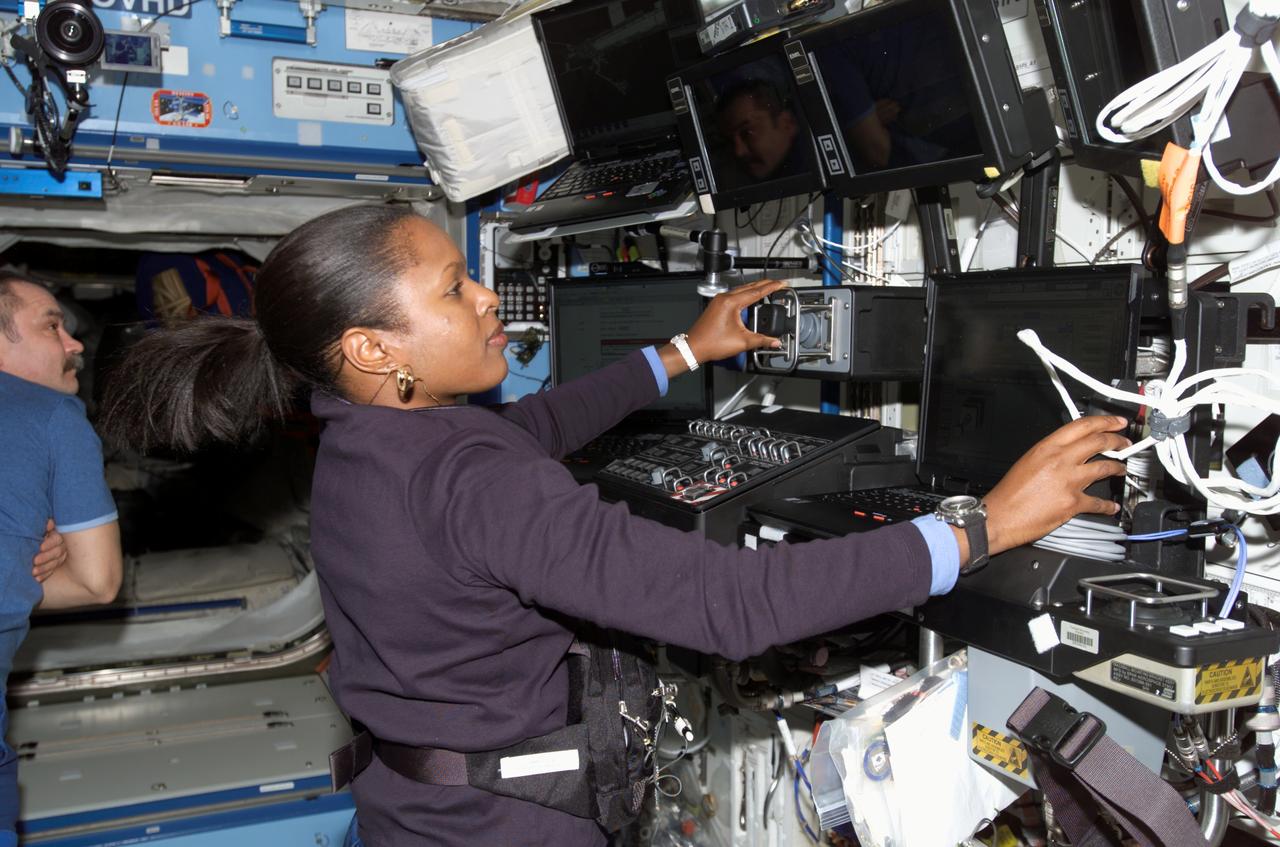 ISS014-E-09631 (12 Dec. 2006) --- Astronaut Joan E. Higginbotham, STS-116 mission specialist, works the controls of the Space Station Remote Manipulator System (SSRMS) or Canadarm2 in the Destiny laboratory of the International Space Station during flight day four activities.