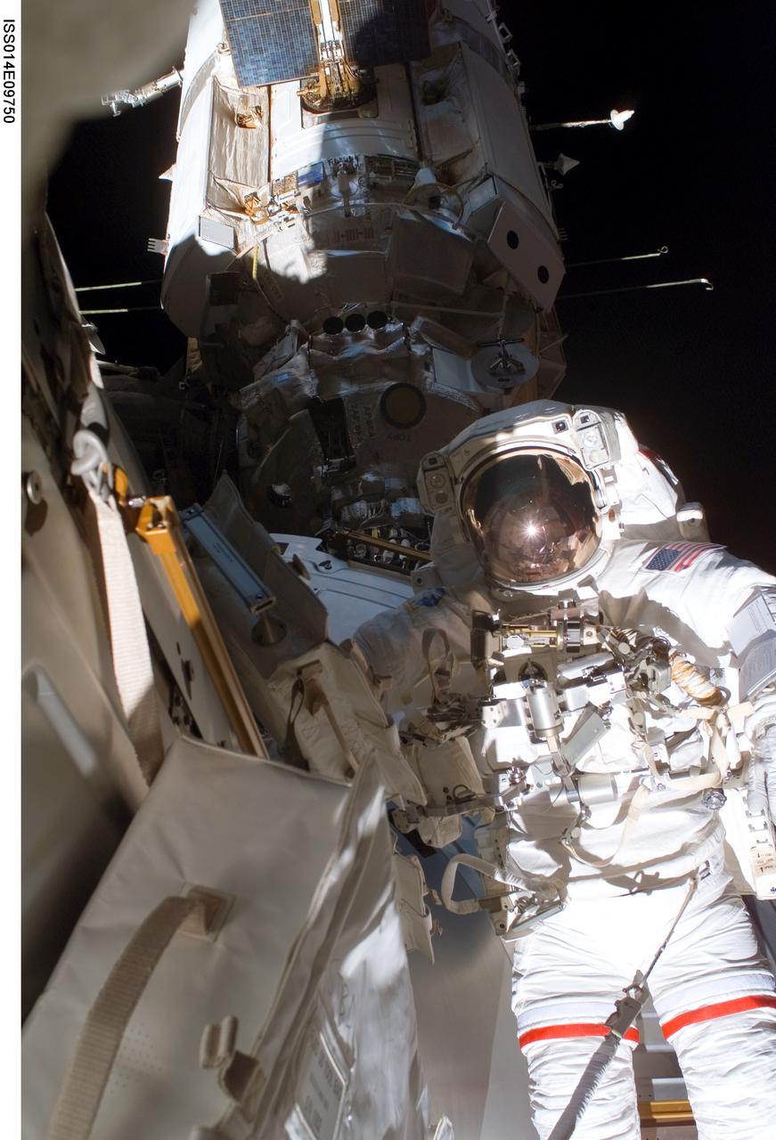 ISS014-E-09750 (14 Dec. 2006) --- Astronaut Robert L. Curbeam, Jr., STS-116 mission specialist, participates in the mission's second of three planned sessions of extravehicular activity (EVA) as construction resumes on the International Space Station. European Space Agency (ESA) astronaut Christer Fuglesang (out of frame), mission specialist, also participated in the spacewalk.