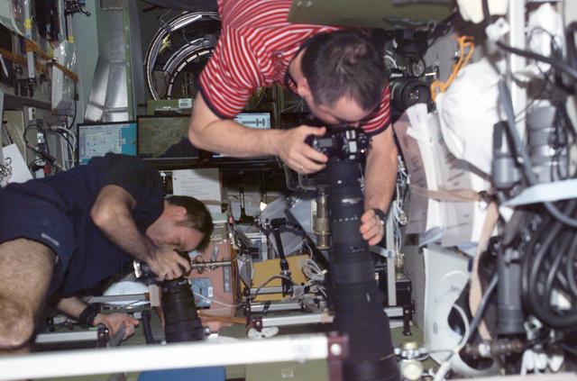 NASA image: Lopez-Alegria and Tyurin in Zvezda with cameras