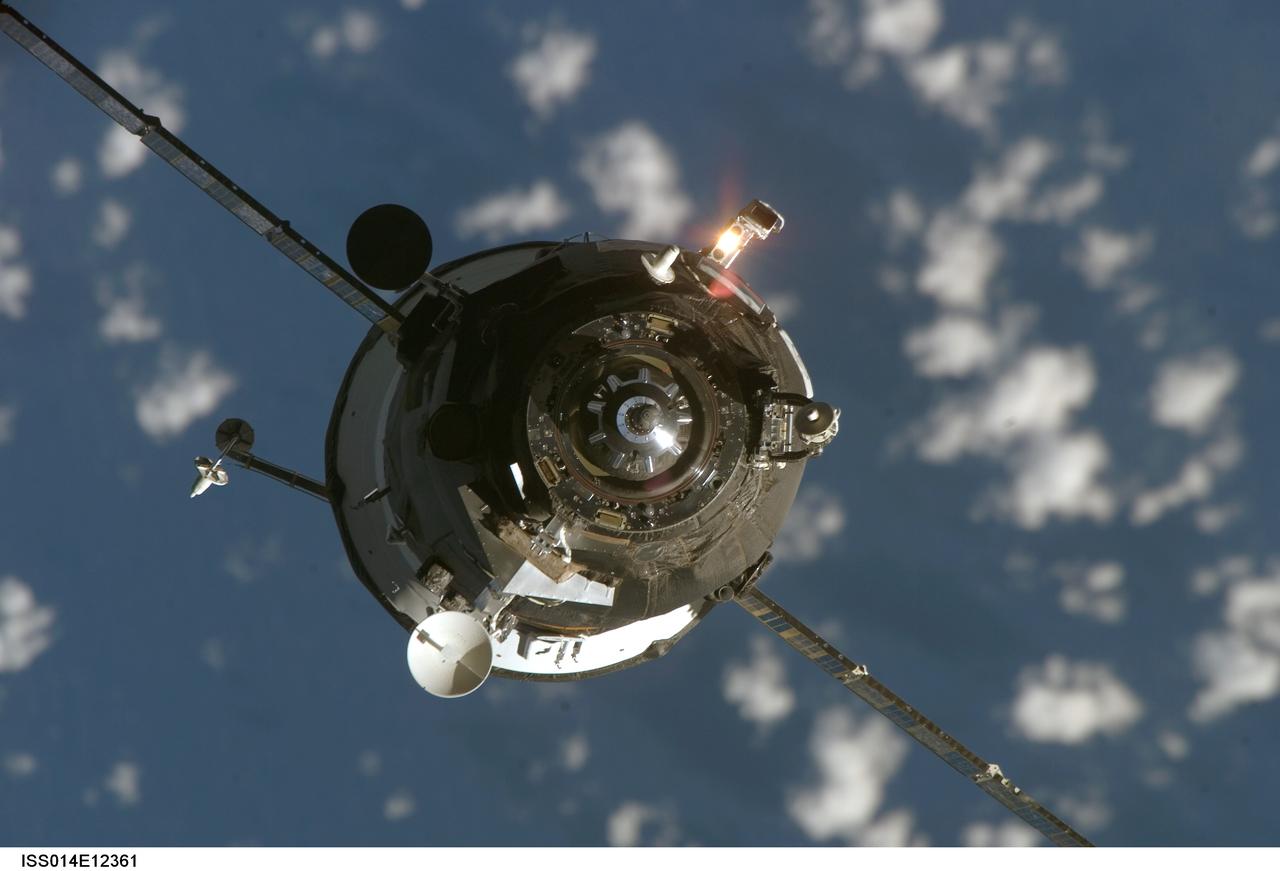 ISS014-E-12361 (19 Jan. 2007) --- Backdropped by a sprinkling of small clouds over a blue Earth, an unpiloted Progress supply vehicle approaches the International Space Station. The Progress 24 resupply craft launched at 8:12 p.m. (CST) on Jan. 17, 2007 from the Baikonur Cosmodrome in Kazakhstan to deliver 2.5 tons of food, fuel, oxygen and other supplies to the Expedition 14 crewmembers onboard the station. Progress automatically docked to the Pirs Docking Compartment at 8:59 p.m. (CST) on Jan. 19 as the spacecraft and the station flew approximately 220 miles above a point near the South Atlantic off the southeast coast of Uruguay.
