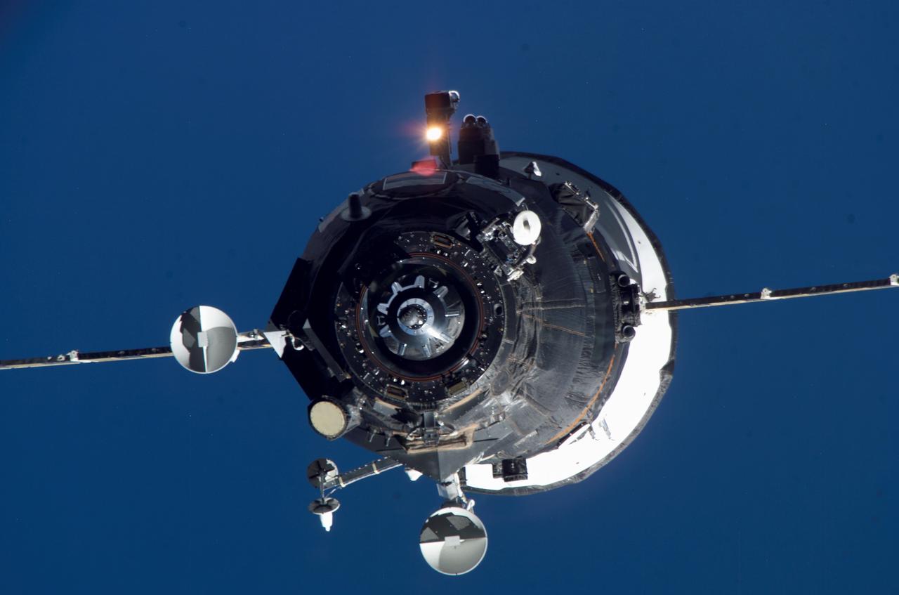 ISS014-E-12364 (19 Jan. 2007) --- Backdropped by a blue Earth, an unpiloted Progress supply vehicle approaches the International Space Station. The Progress 24 resupply craft launched at 8:12 p.m. (CST) on Jan. 17, 2007 from the Baikonur Cosmodrome in Kazakhstan to deliver 2.5 tons of food, fuel, oxygen and other supplies to the Expedition 14 crewmembers onboard the station. Progress automatically docked to the Pirs Docking Compartment at 8:59 p.m. (CST) on Jan. 19 as the spacecraft and the station flew approximately 220 miles above a point near the South Atlantic off the southeast coast of Uruguay.