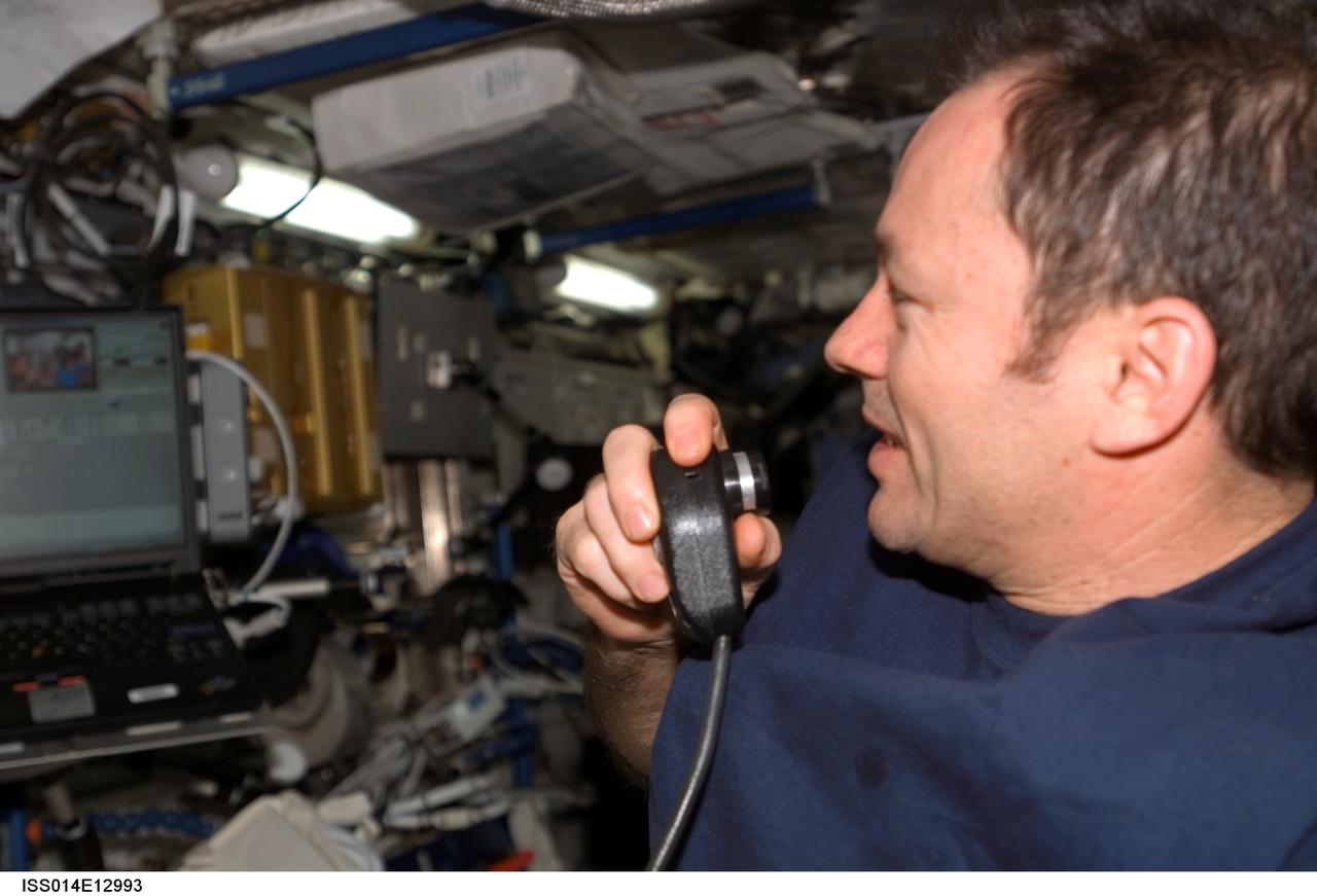 ISS014-E-12993 (26 Jan. 2007) --- Astronaut Michael E. Lopez-Alegria, Expedition 14 commander and NASA space station science officer, uses a communication system in the Destiny laboratory of the International Space Station.