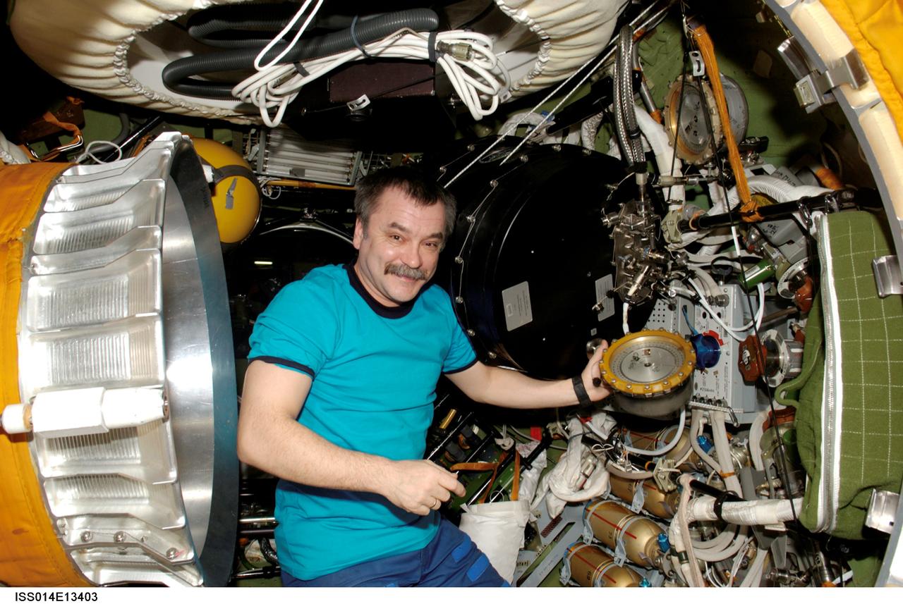 ISS014-E-13403 (February 2007) --- Cosmonaut Mikhail Tyurin, Expedition 14 flight engineer representing Russia's Federal Space Agency, works with hardware in the Pirs Docking Compartment of the International Space Station.