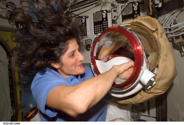 NASA image: Williams with EMU helmet in Quest airlock