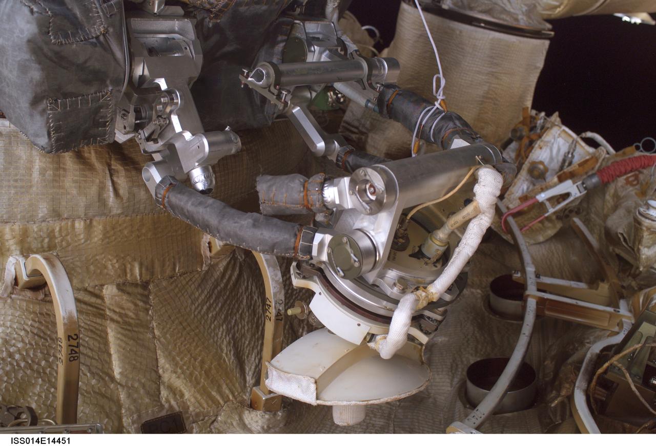 ISS014-E-14451 (22 Feb. 2007) --- A close-up view of the Kurs antenna on the Progress vehicle docked to the International Space Station's Zvezda Service Module was photographed during a session of extravehicular activity (EVA) on Feb. 22, 2007. During the 6-hour, 18-minute spacewalk, astronaut Michael E. Lopez-Alegria (out of frame), Expedition 14 commander and NASA space station science officer; and cosmonaut Mikhail Tyurin (out of frame), flight engineer representing Russia's Federal Space Agency, were able to retract the stuck antenna which did not properly retract when the Progress docked to the station on Oct. 26, 2006. Moving the antenna was necessary to ensure it would not interfere with the undocking scheduled in April.