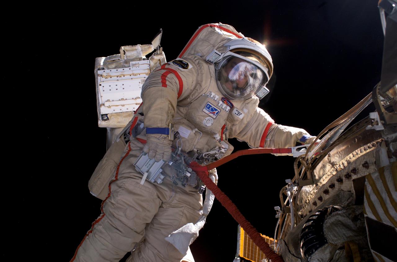 ISS014-E-14467 (22 Feb. 2007) --- Cosmonaut Mikhail Tyurin, Expedition 14 flight engineer representing Russia's Federal Space Agency, wearing a Russian Orlan spacesuit, participates in a session of extravehicular activity (EVA). Among other tasks, Tyurin and astronaut Michael E. Lopez-Alegria (out of frame), commander and NASA space station science officer, were able to retract a stuck Kurs antenna on the Progress vehicle docked to the International Space Station's Zvezda Service Module.