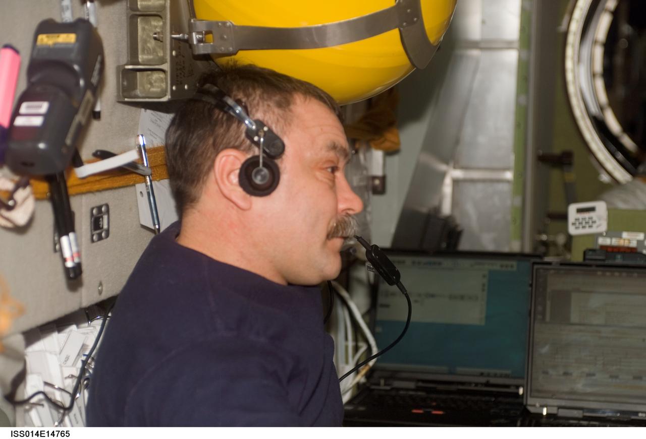 ISS014-E-14765 (24 Feb. 2007) --- Cosmonaut Mikhail Tyurin, Expedition 14 flight engineer representing Russia's Federal Space Agency, uses a communication system in the Zvezda Service Module of the International Space Station.