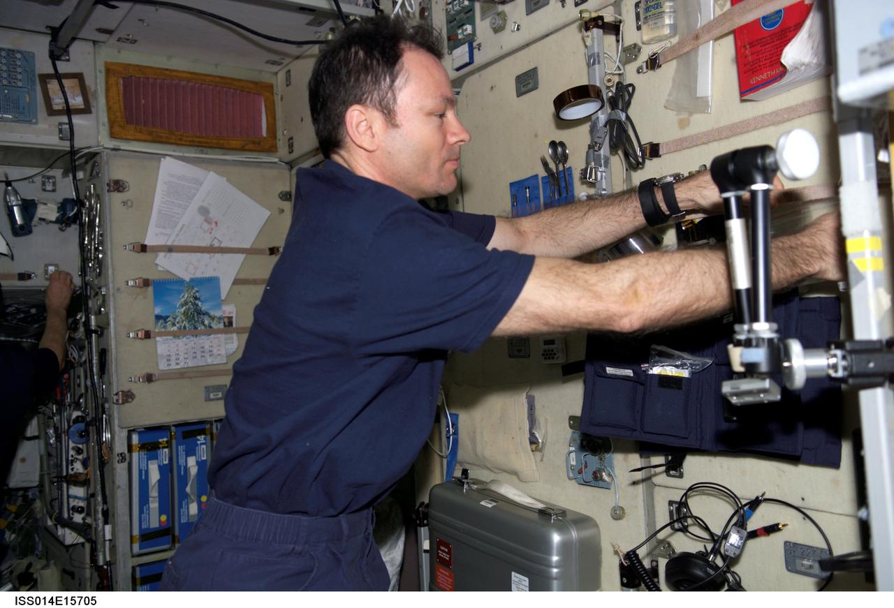ISS014-E-15705 (1 March 2007) --- Astronaut Michael E. Lopez-Alegria, Expedition 14 commander and NASA space station science officer, works in the Zvezda Service Module of the International Space Station.