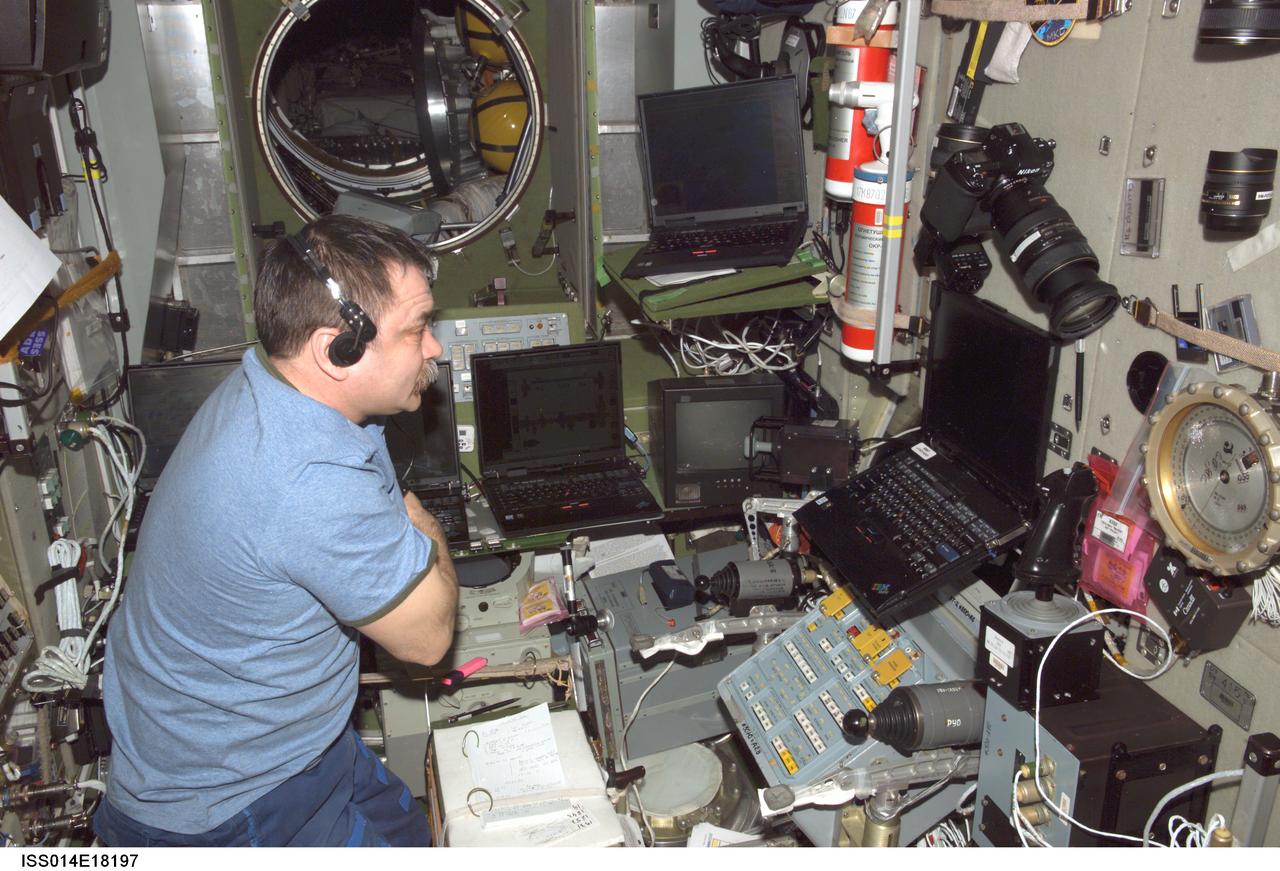 ISS014-E-18197 (27 March 2007) --- Cosmonaut Mikhail Tyurin, Expedition 14 flight engineer representing Russia's Federal Space Agency, monitors data at the TORU teleoperated control system in the Zvezda Service Module of the International Space Station in preparation for the undocking of the Progress 23 supply vehicle.
