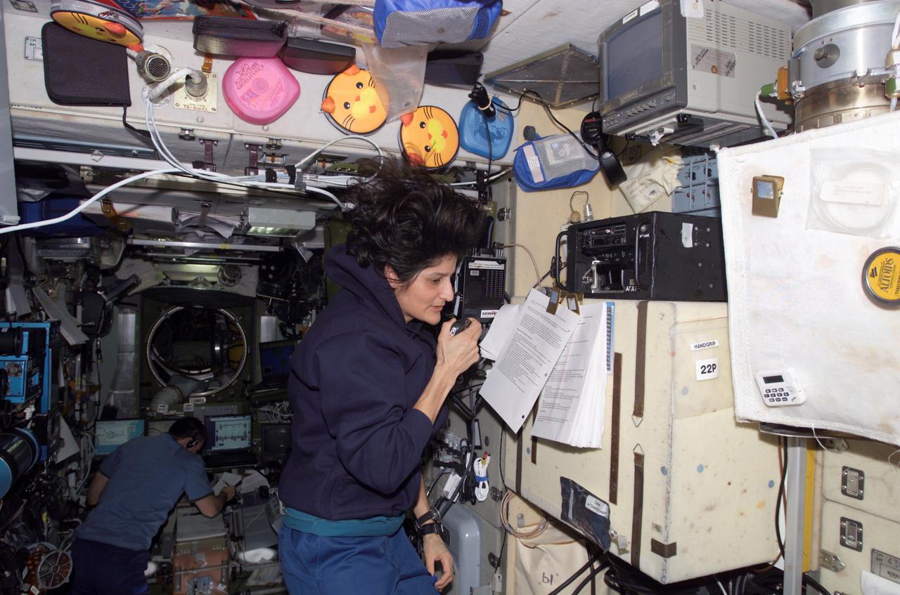 ISS014-E-18306 (27 March 2007) --- Astronaut Sunita L. Williams, Expedition 14 flight engineer, talks with students at the International School of Brussels in Belgium during an Amateur Radio on the International Space Station (ARISS) contact in the Zvezda Service Module.
