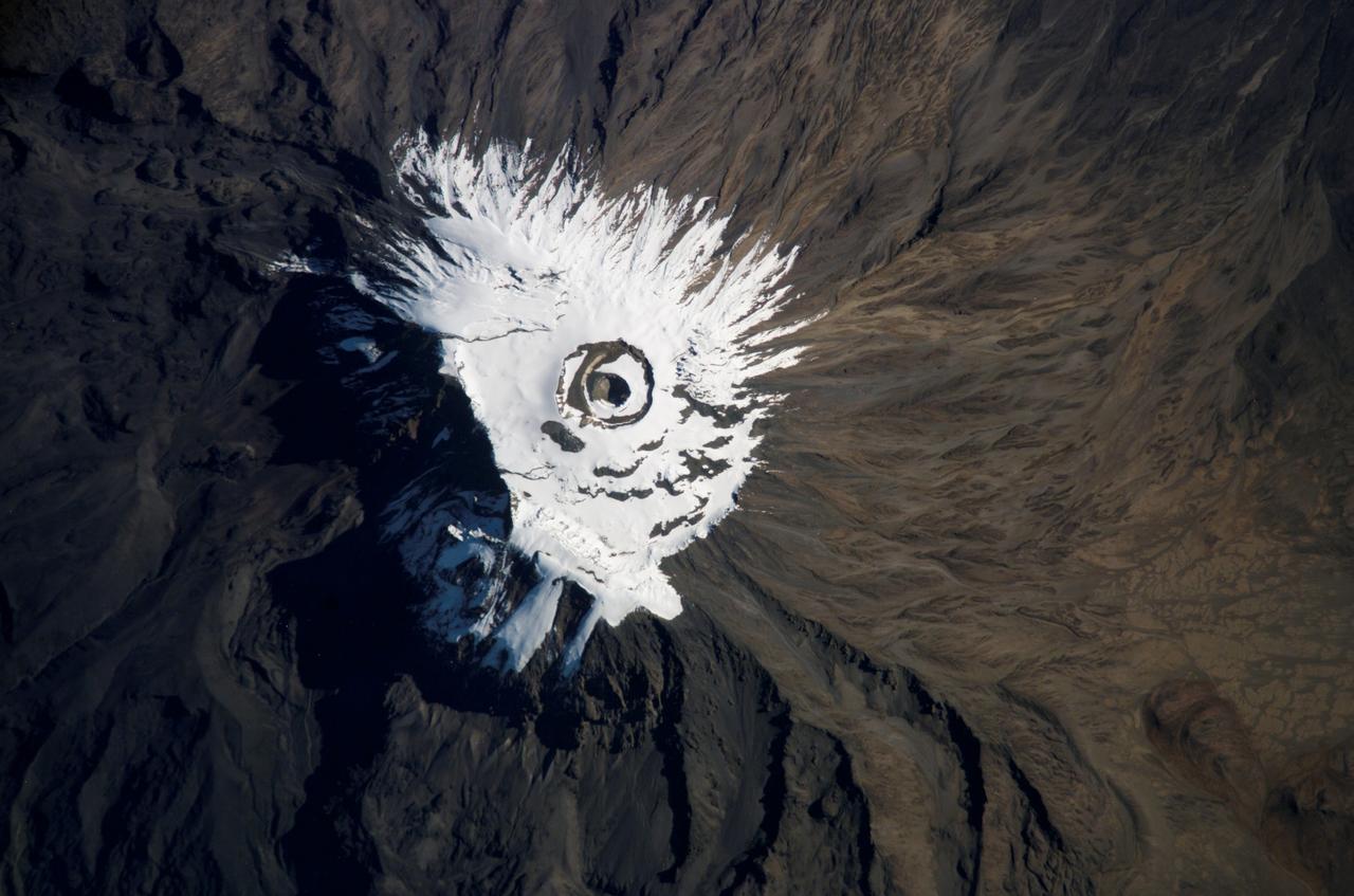 ISS014-E-18950 (3 April 2007) --- Covered with snow and ice, Mount Kilimanjaro, Tanzania is featured in this image photographed by an Expedition 14 crewmember on the International Space Station.