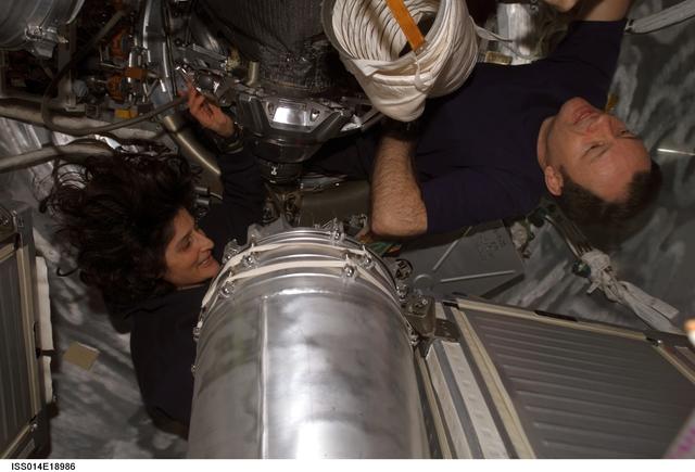 NASA image: Lopez-Alegria and Williams with Water Tanks in Progress 24 spacecraft